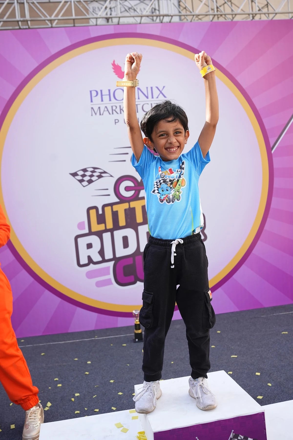 A Little Ridder Cup child rider smiling at an event